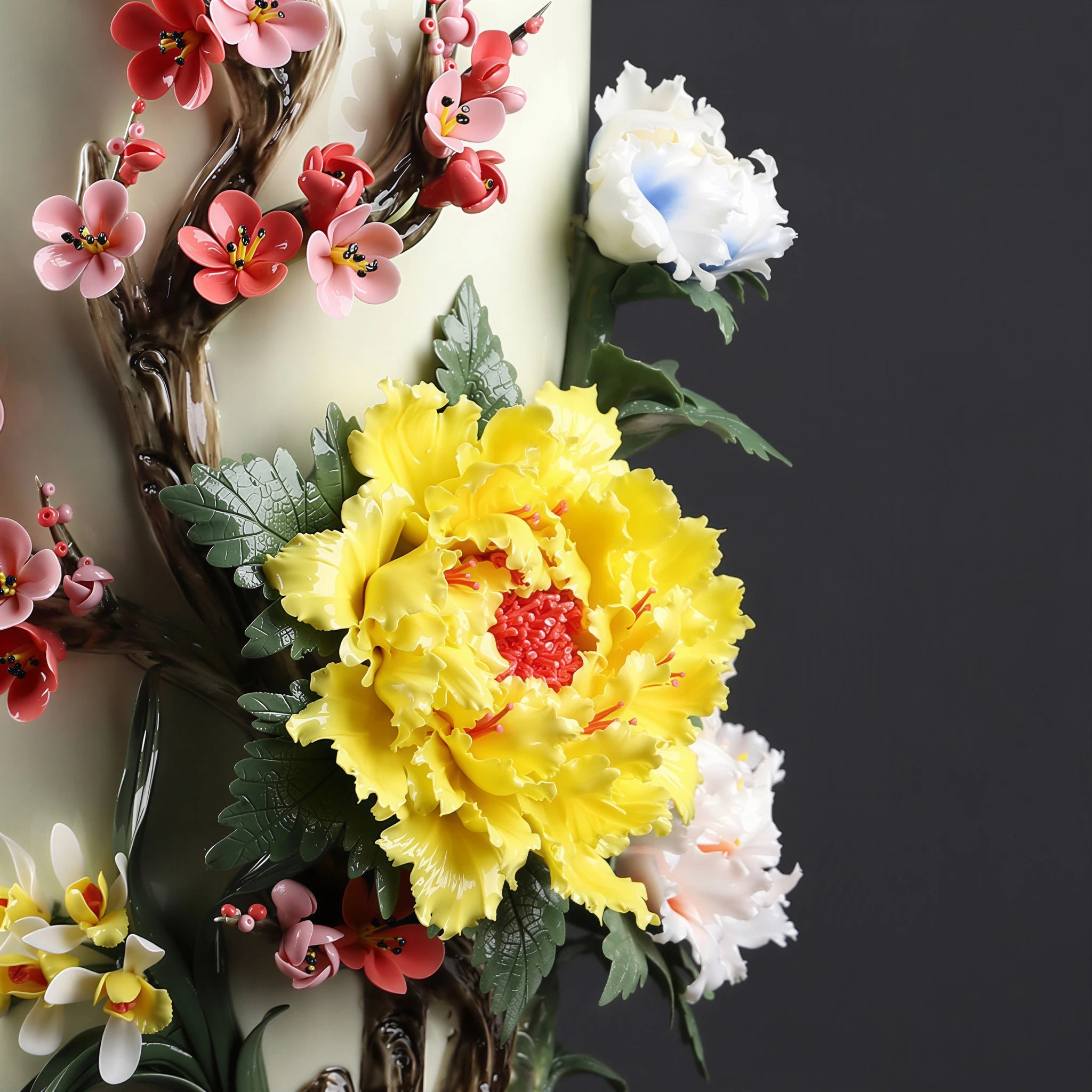 Detailed view of peonies, plum blossoms and orchid relief on the porcelain body