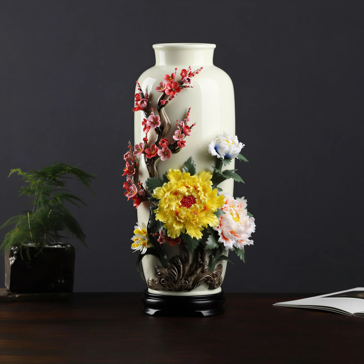 Full view of the Dehua vase with red plum blossom, peony and orchid relief