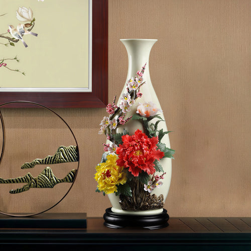 Peony and plum blossom Yuhuchun vase displayed on a cabinet