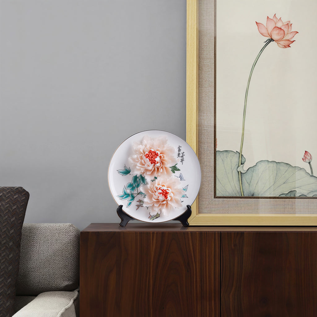 Dehua peony porcelain display plate styled on a cabinet