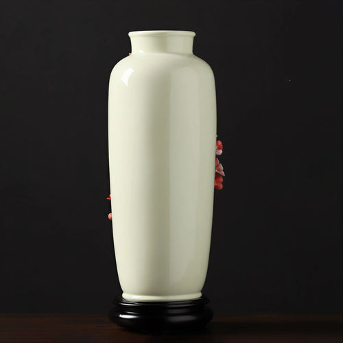 Rear view of the ivory-white plum blossom vase on its black stand