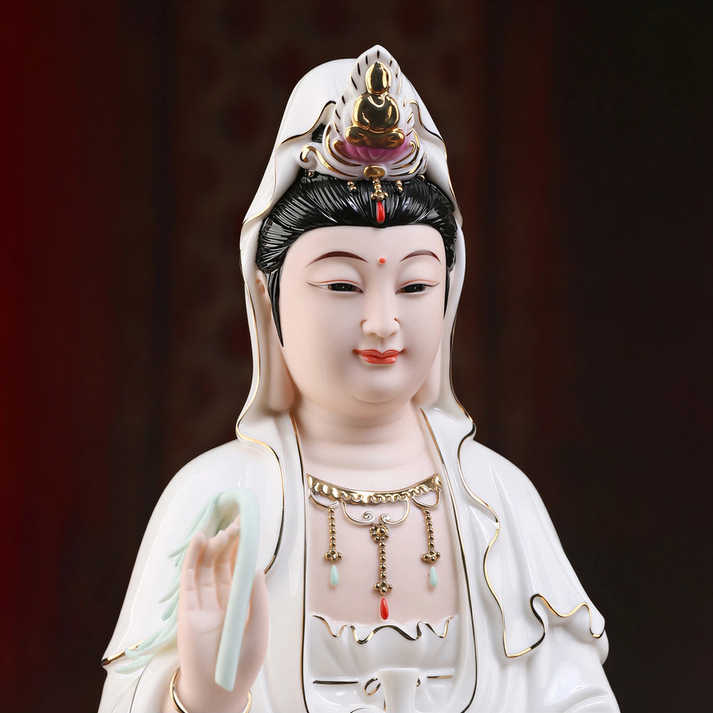 Close view of the Guanyin face, headdress and colored jewelry details
