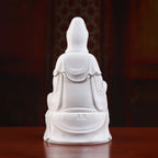 Rear view of the flowing white robes on the polychrome Guanyin sculpture