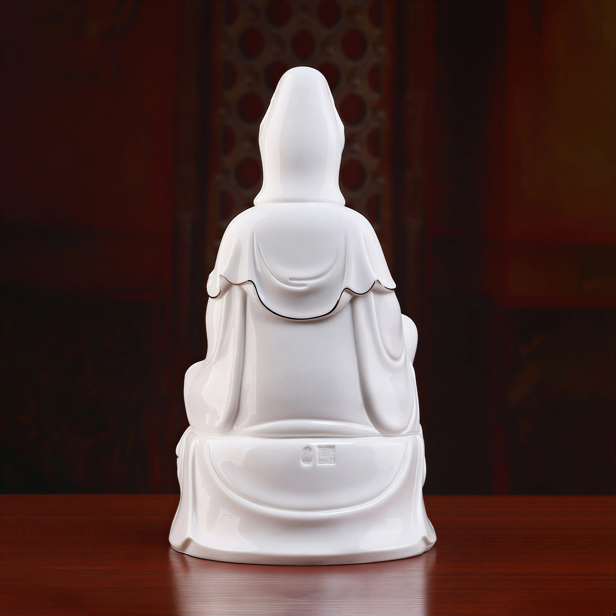 Rear view of the flowing white robes on the polychrome Guanyin sculpture