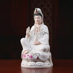 Angled view of the polychrome Guanyin and gold-toned painted details