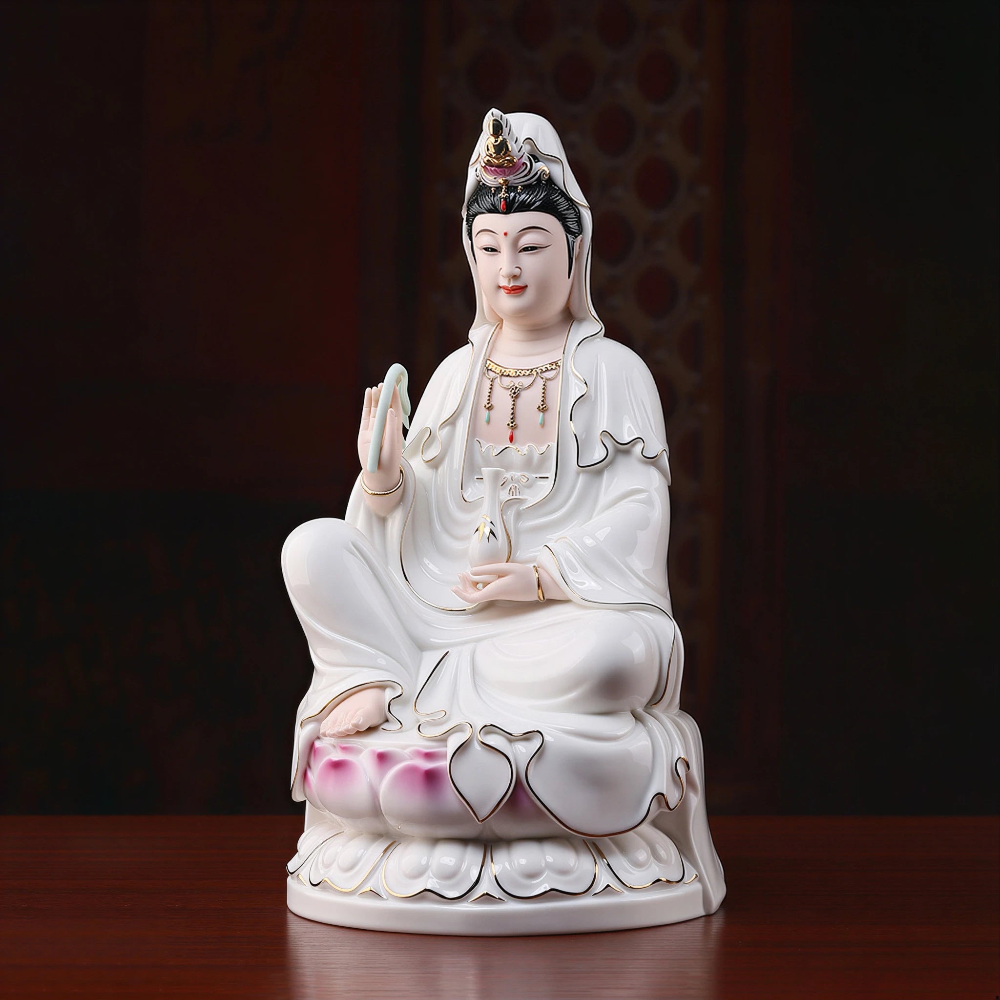 Angled view of the polychrome Guanyin and gold-toned painted details