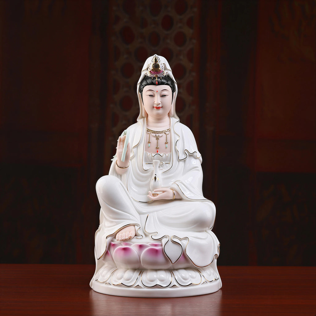 Front view of a polychrome Dehua porcelain Guanyin seated on a pink lotus