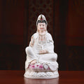 Front view of a polychrome Dehua porcelain Guanyin seated on a pink lotus