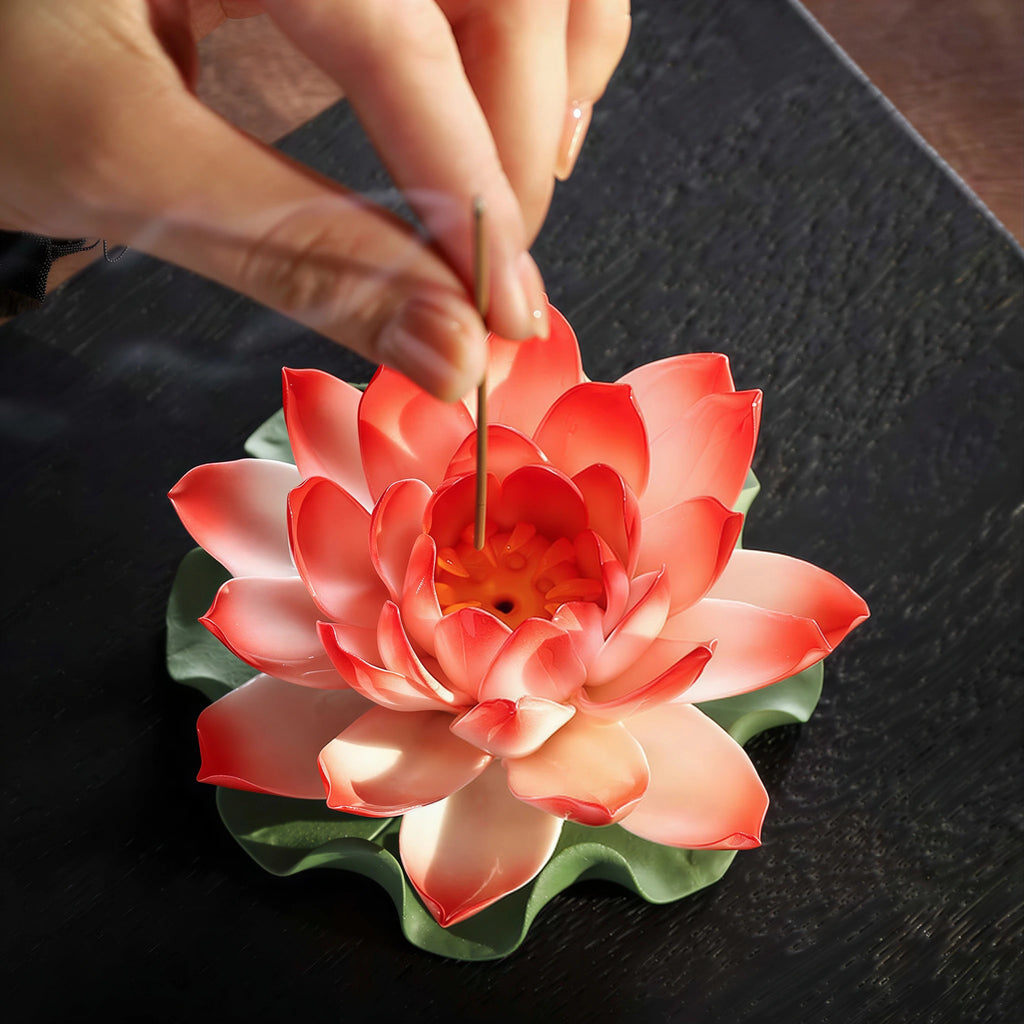 Polychrome porcelain lotus shown at hand scale