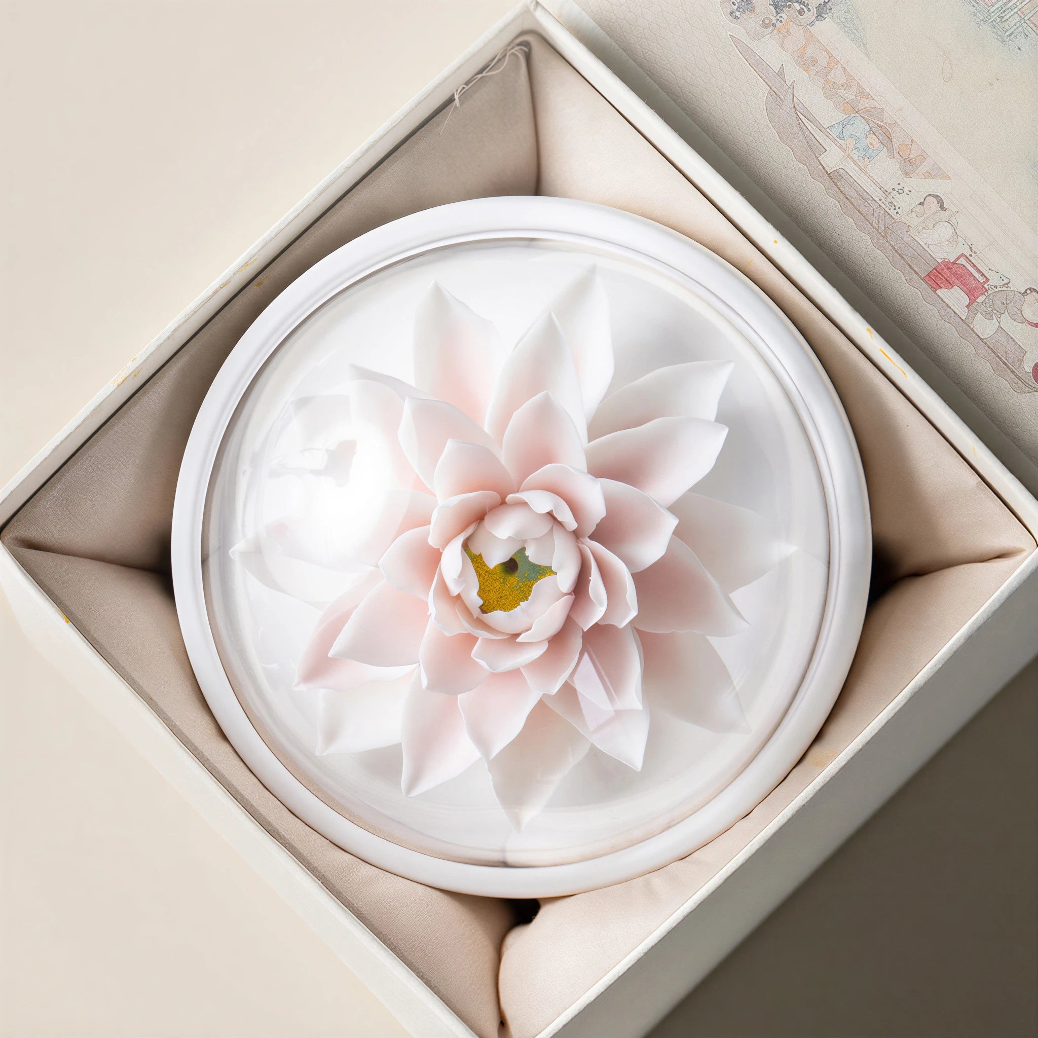 White porcelain lotus arranged inside its presentation box