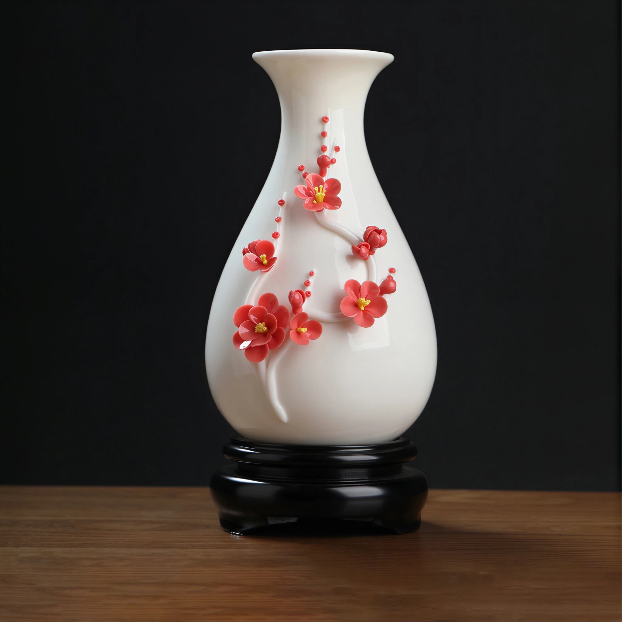 Red plum blossom relief on a white pear-shaped Dehua porcelain vase