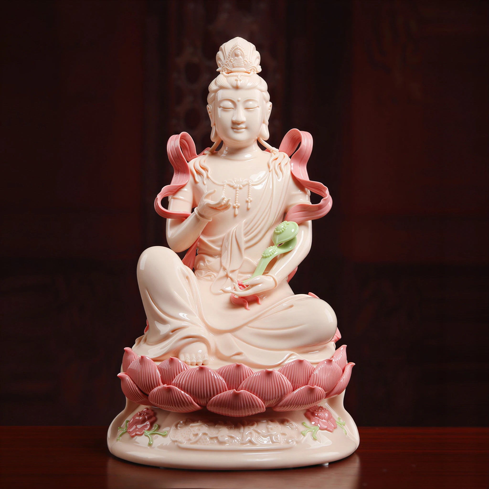 Front view of jade-red Dehua porcelain Samantabhadra seated on a lotus