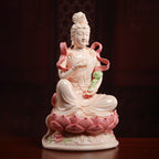 Angled view of Samantabhadra holding a green lotus stem