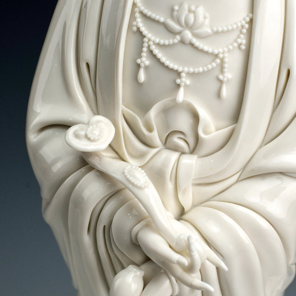 Detail of the Guanyin hands holding the traditional ruyi