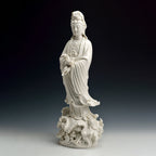 Angled view of the flowing robes and ruyi on the standing Guanyin