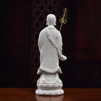 Rear view of the long white robes on the standing Ksitigarbha sculpture