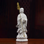 Three-quarter view of the standing Ksitigarbha figure and flaming jewel