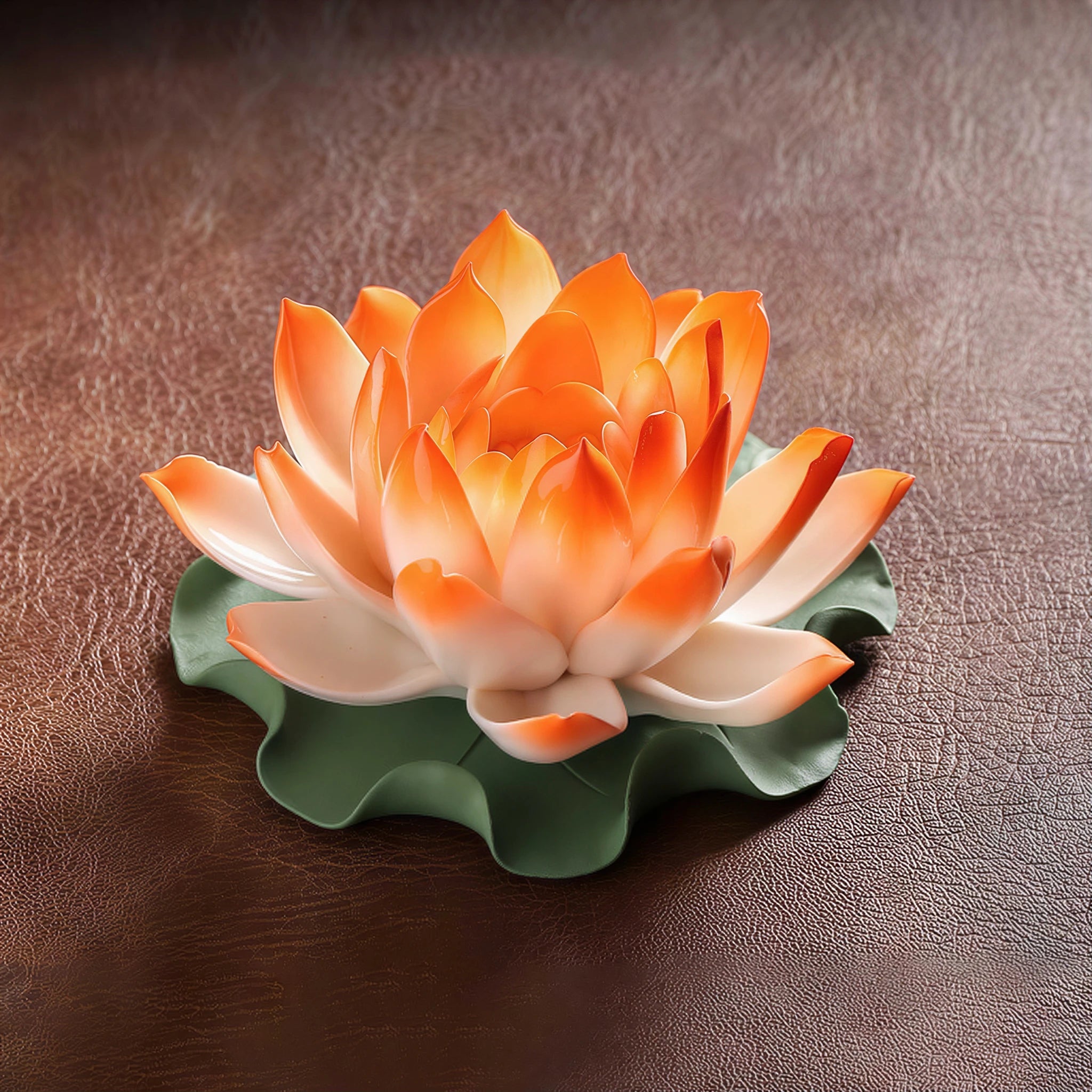 Sunset orange porcelain lotus on a green lily pad