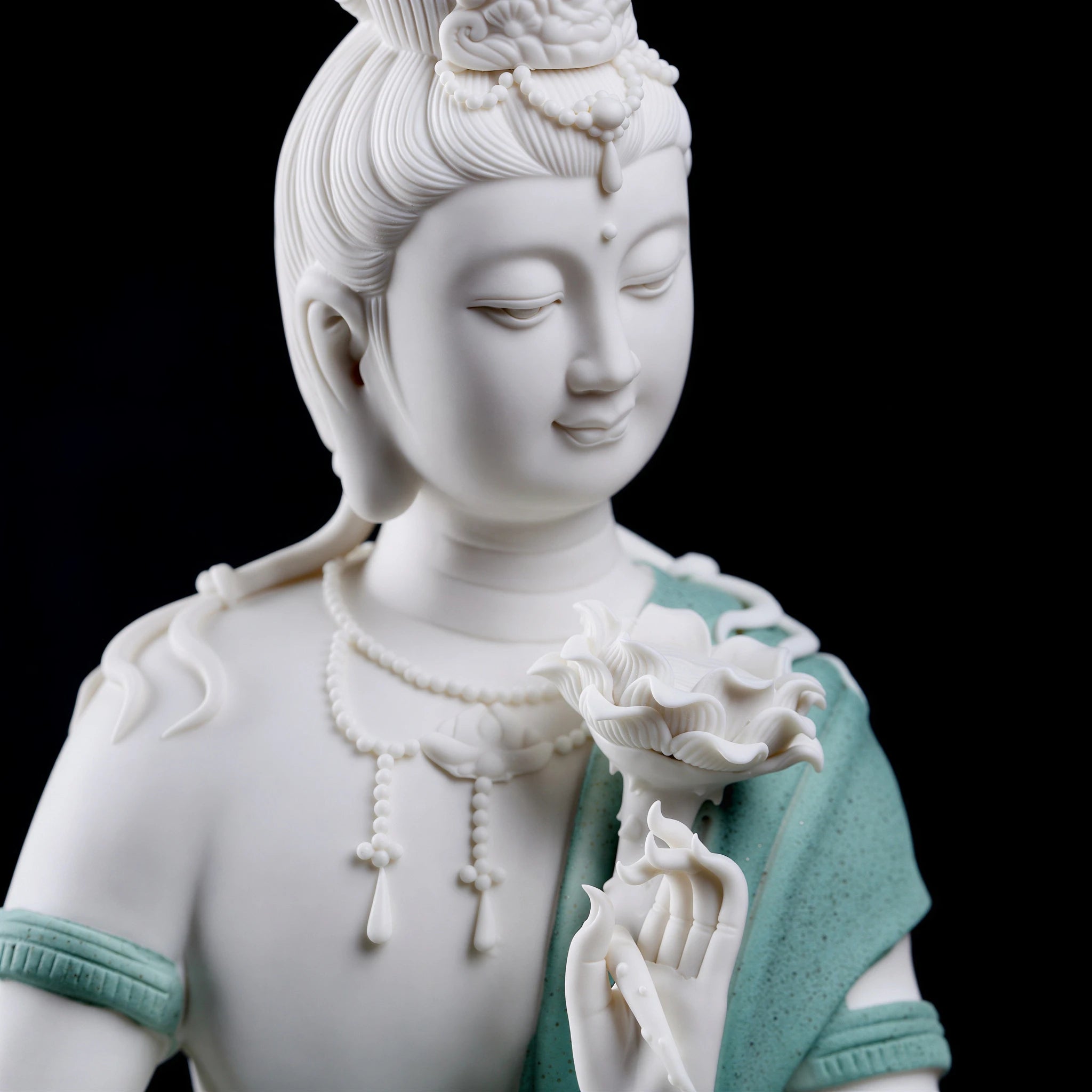 Close view of the Water Moon Guanyin face and jewelry details