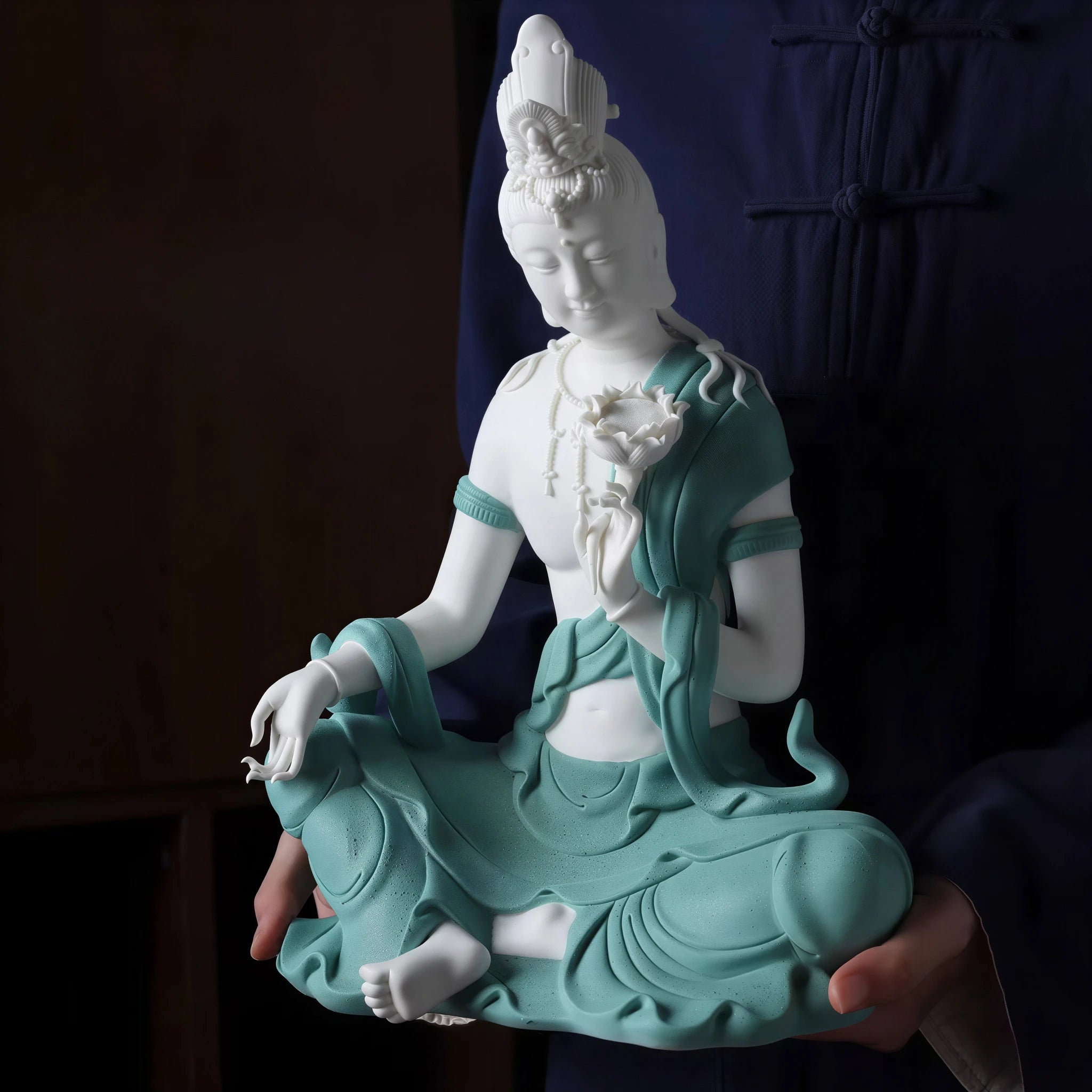 Front view of textured teal Water Moon Guanyin in the royal-ease posture