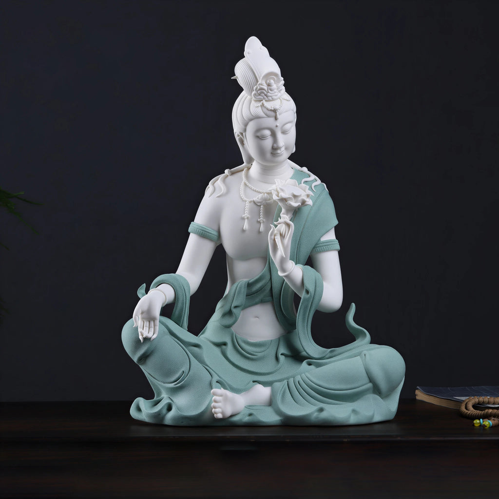 Angled view of white Dehua porcelain Water Moon Guanyin holding a lotus