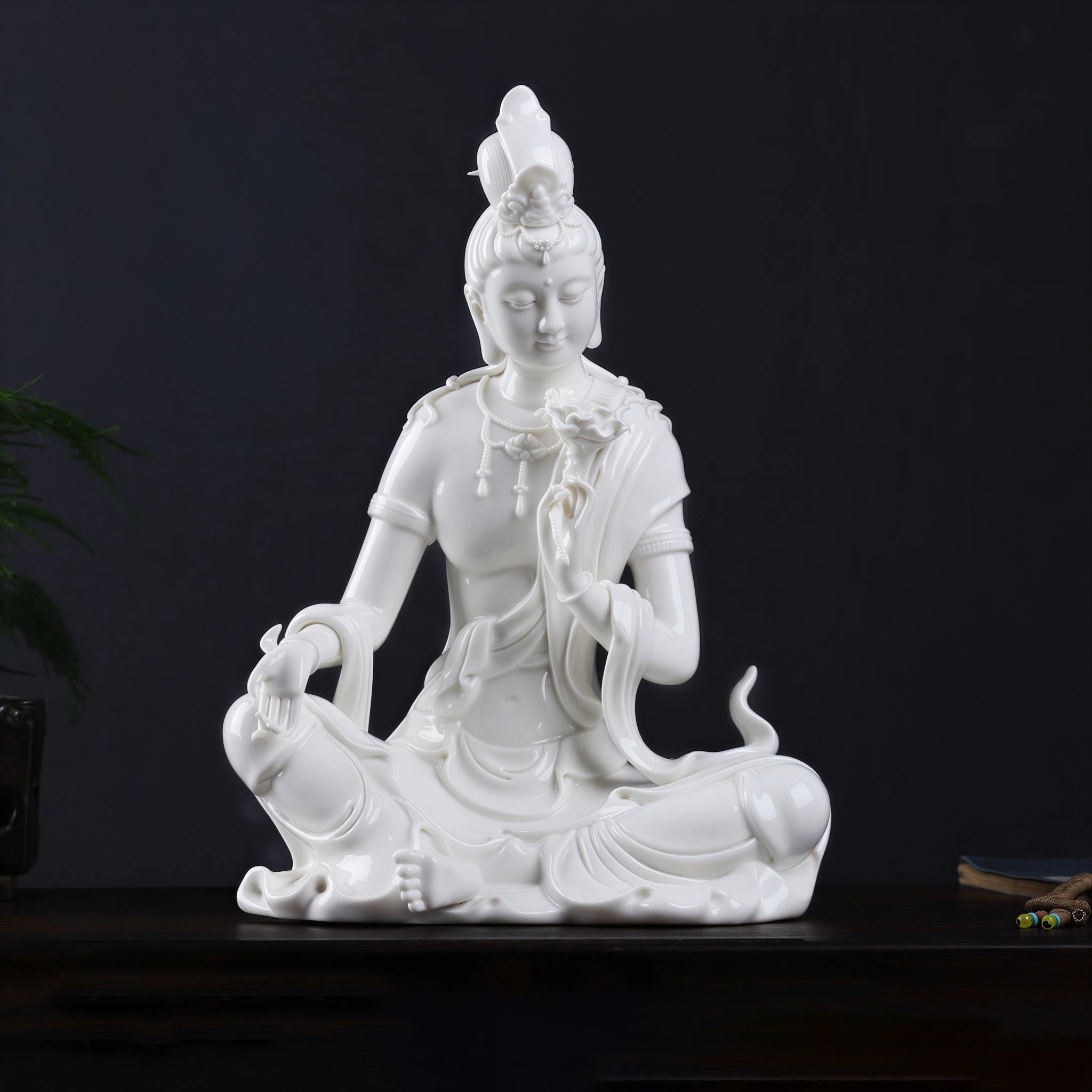 Front view of white Water Moon Guanyin seated in the royal-ease posture
