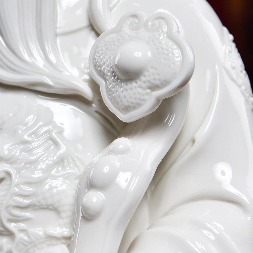 Dehua Wen Caishen sculpture arranged on an entryway console