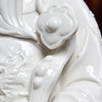 Dehua Wen Caishen sculpture arranged on an entryway console