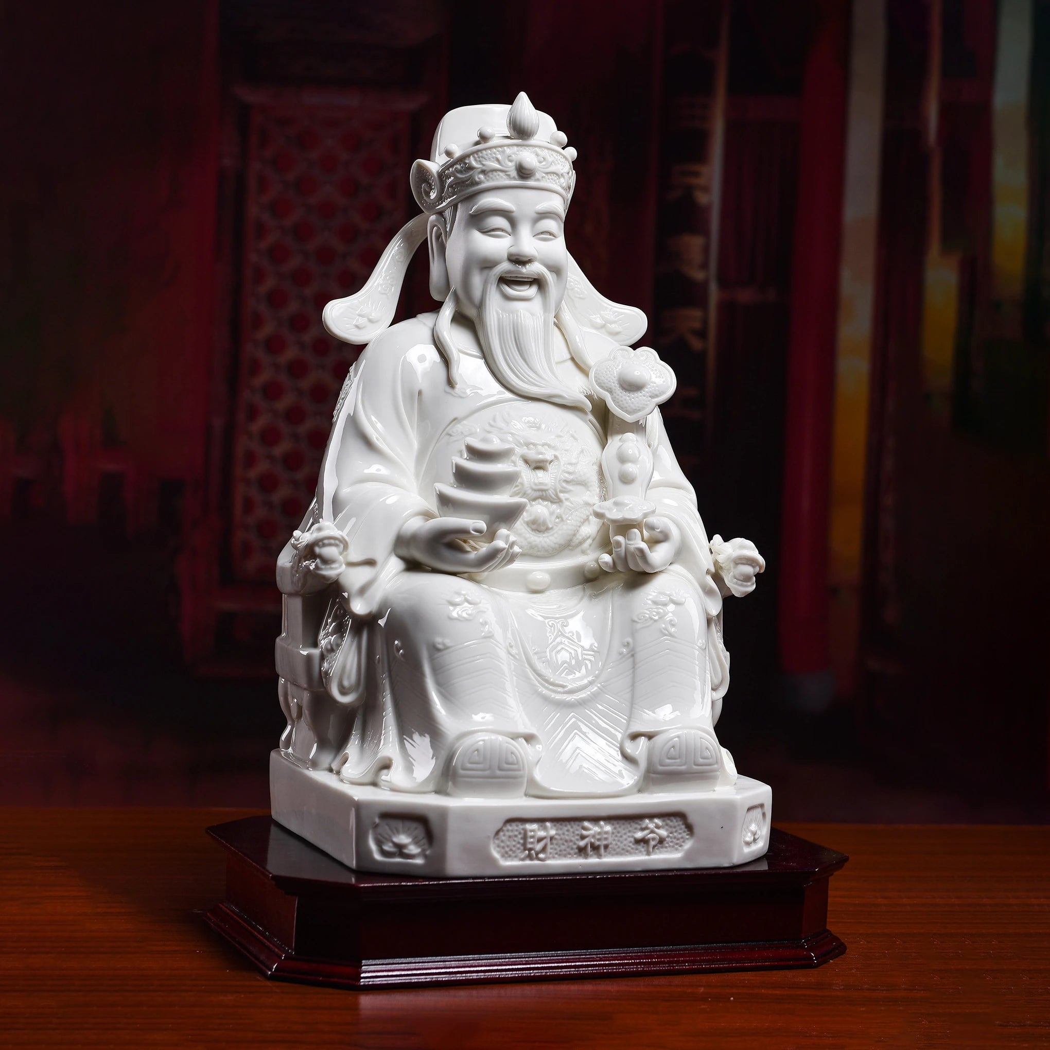 Dehua Wen Caishen sculpture displayed in a quiet study