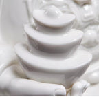 Stacked ingot relief detail on a white porcelain Caishen sculpture