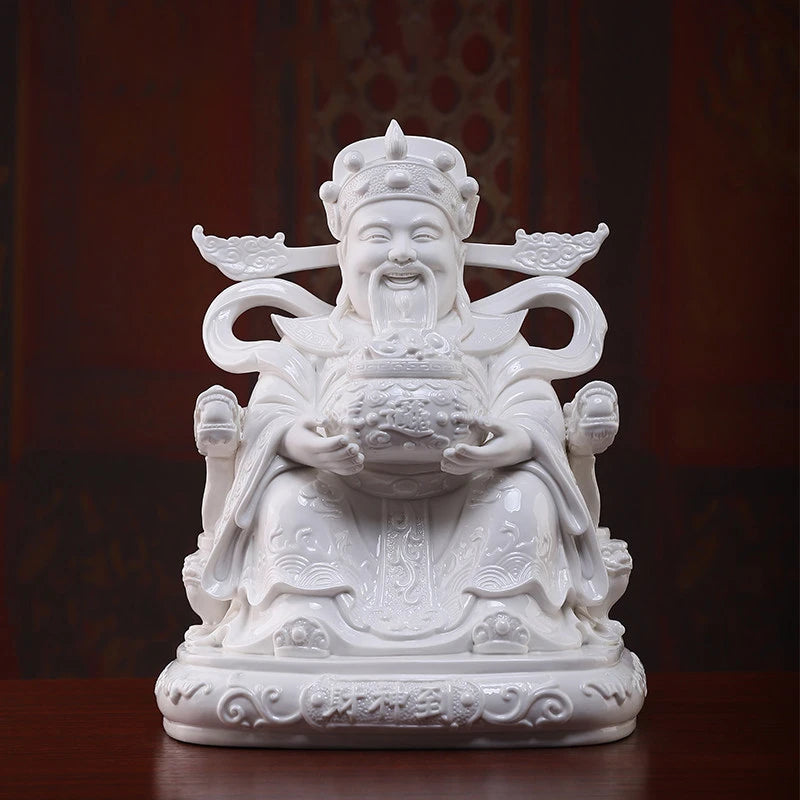 White porcelain Wen Caishen with treasure bowl and flowing ribbons