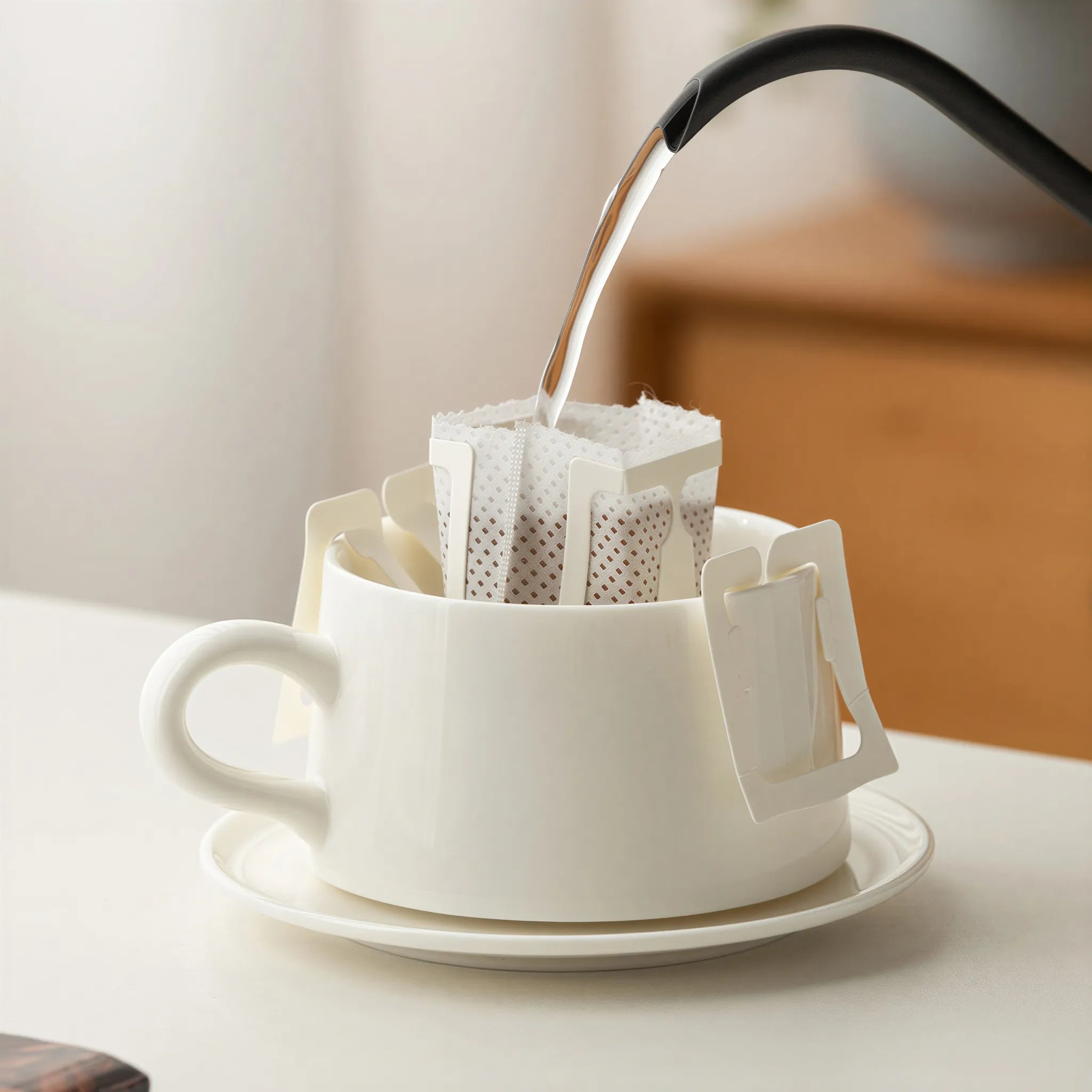 Drip coffee brewing directly into the Dehua white porcelain cup