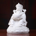 Angled view of the white Dehua Fu Bao Caishen and ingot