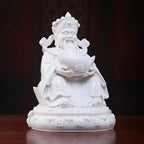 Front view of the white porcelain Fu Bao Caishen seated on a throne