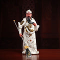 Full view of the white porcelain standing Guan Gong with gold-toned details