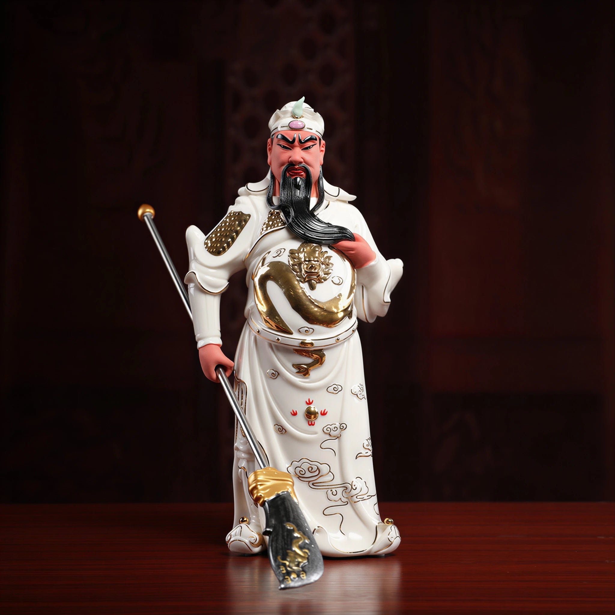 Full view of the white porcelain standing Guan Gong with gold-toned details