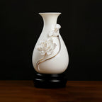 White and gold-toned lotus relief on a Dehua porcelain vase