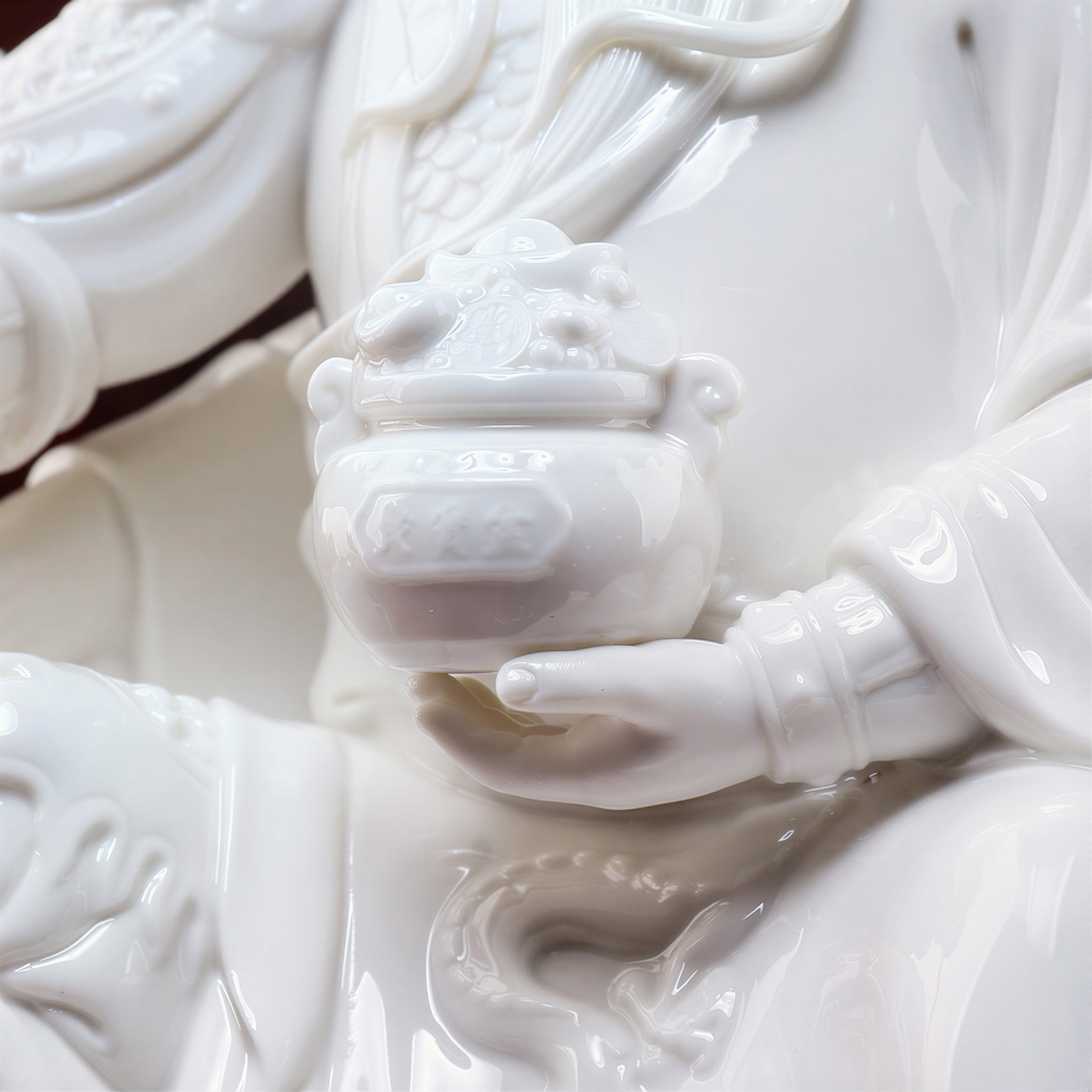 Close view of the impressed mark on the white porcelain Guan Gong