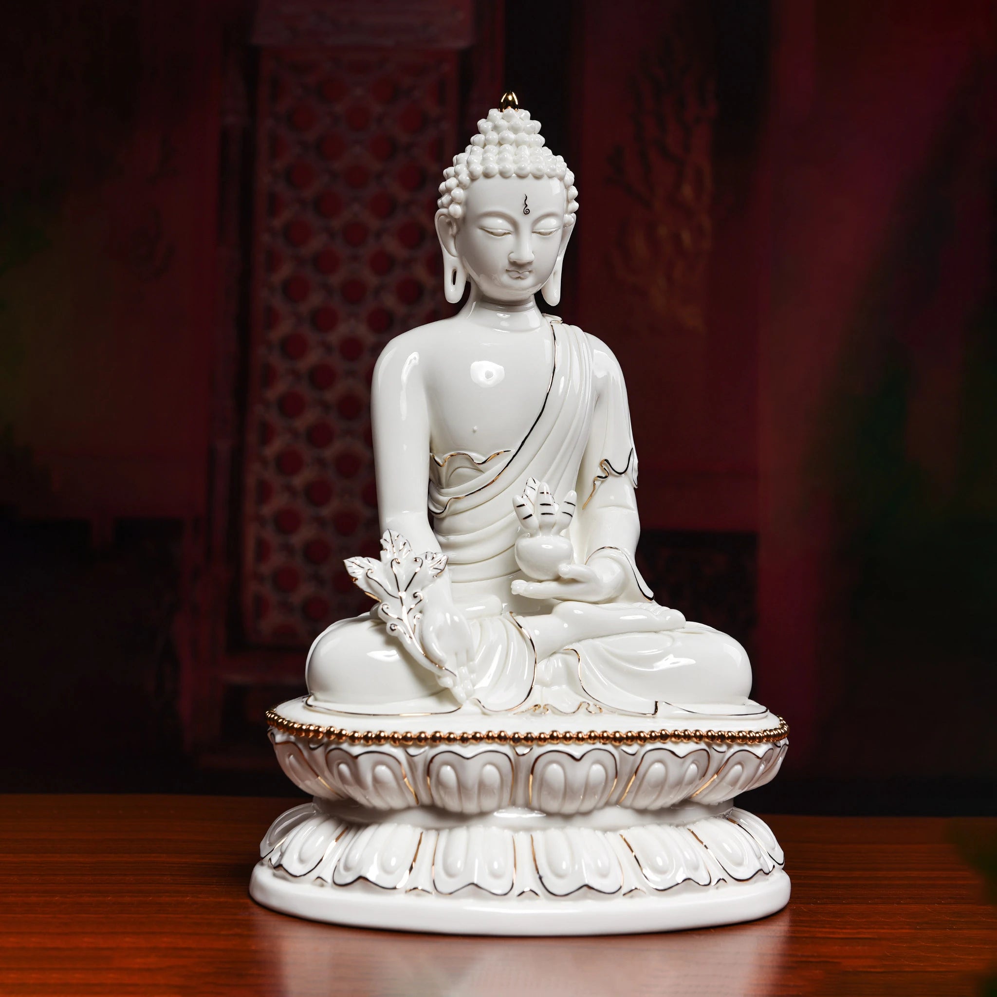 Three-quarter view of the seated Medicine Buddha holding a medicine bowl