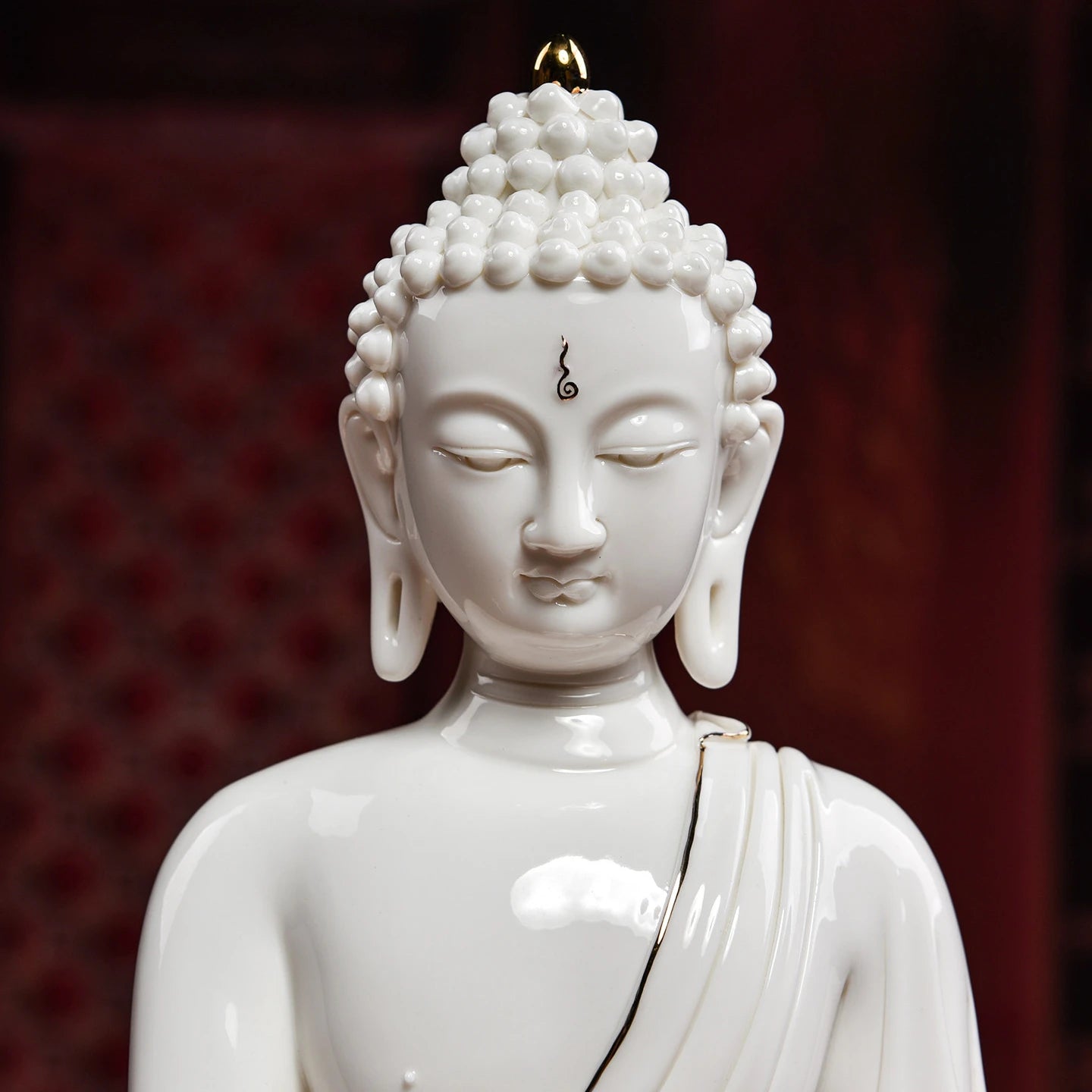 Close view of the white Medicine Buddha face and ushnisha