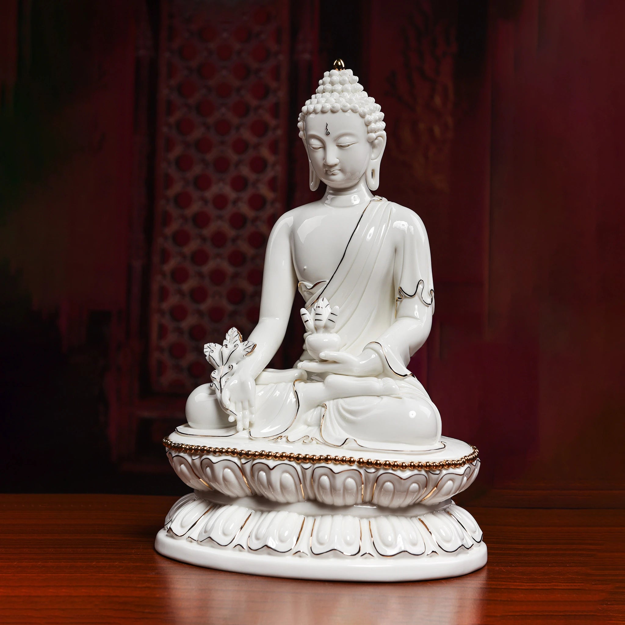 Angled view of the Medicine Buddha with medicinal plant and gold-toned details