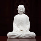 Front view of a seated white Dehua porcelain Ksitigarbha