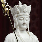 Close view of the Ksitigarbha face and white porcelain headdress