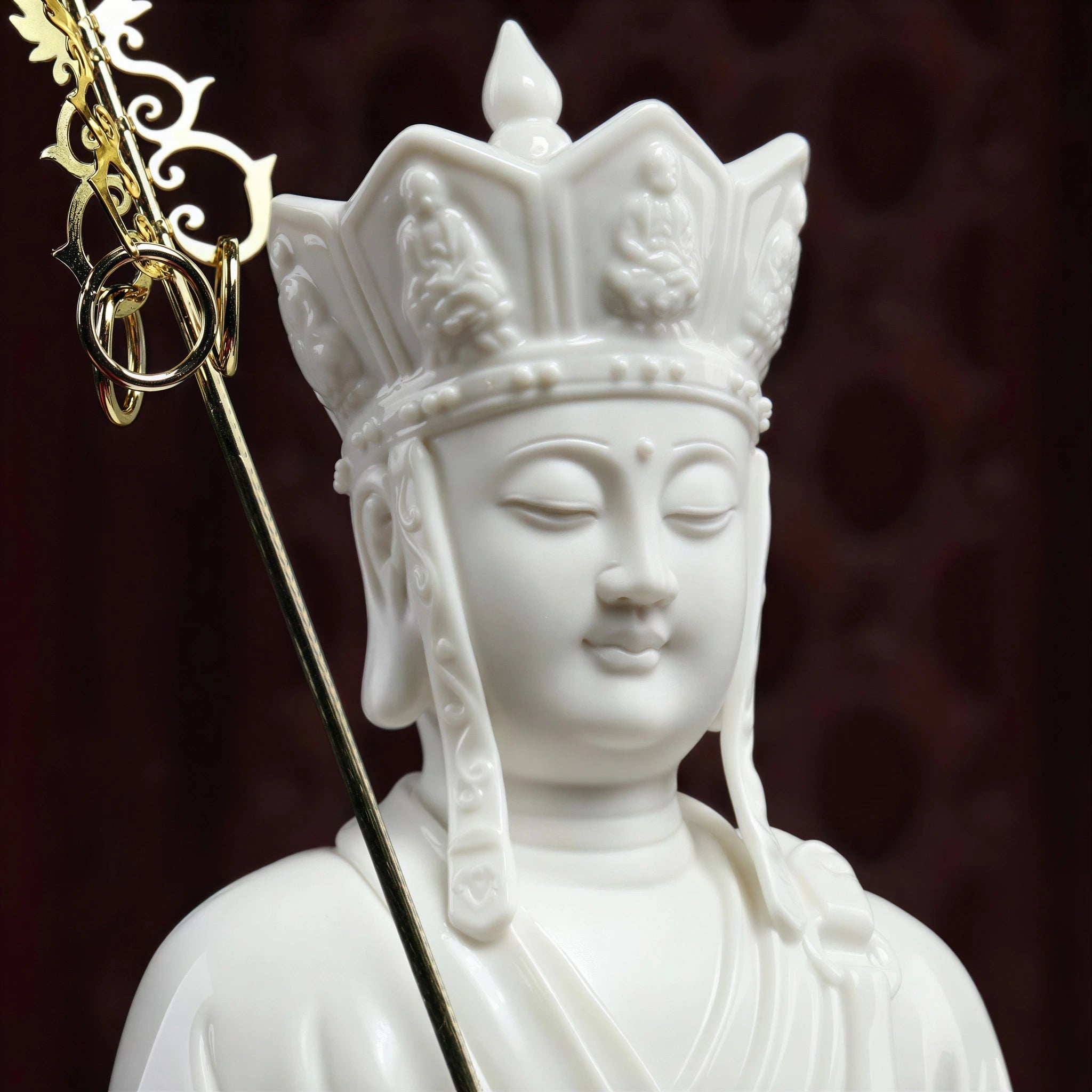 Close view of the Ksitigarbha face and white porcelain headdress