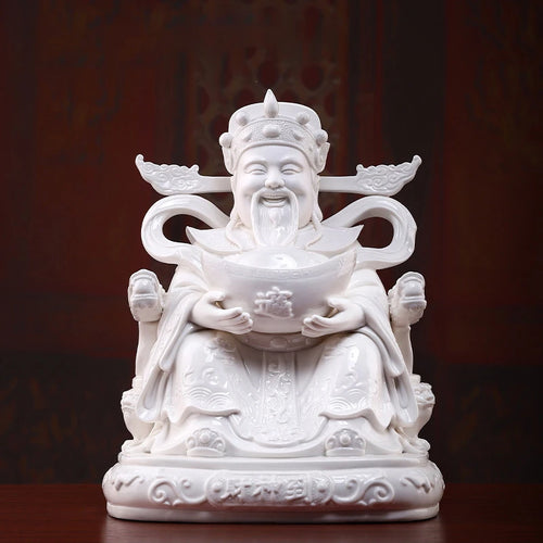 Dehua white porcelain Wen Caishen seated with an ingot, front view