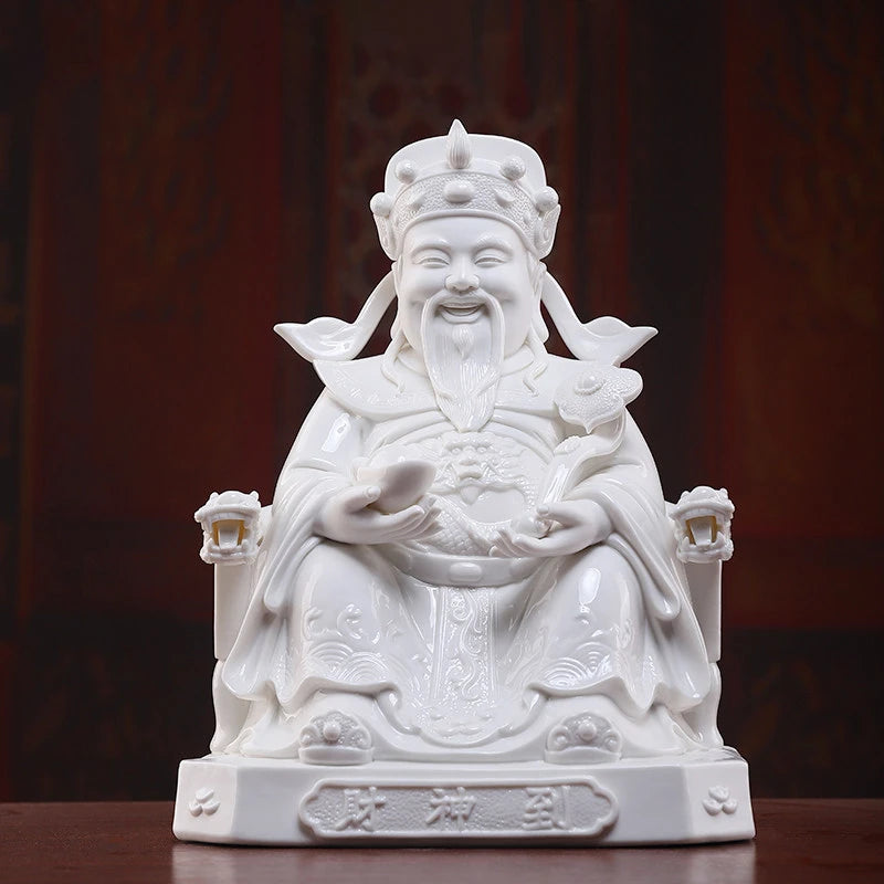 Dehua white porcelain Wen Caishen holding a ruyi scepter