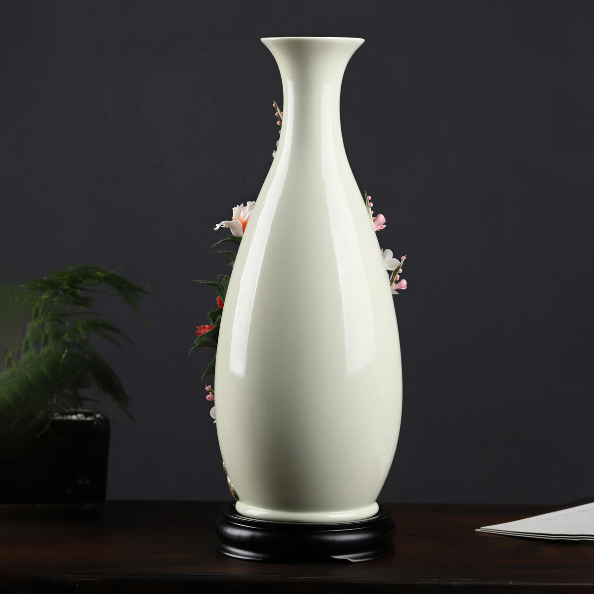 Rear profile of the ivory-white Yuhuchun vase on its black stand