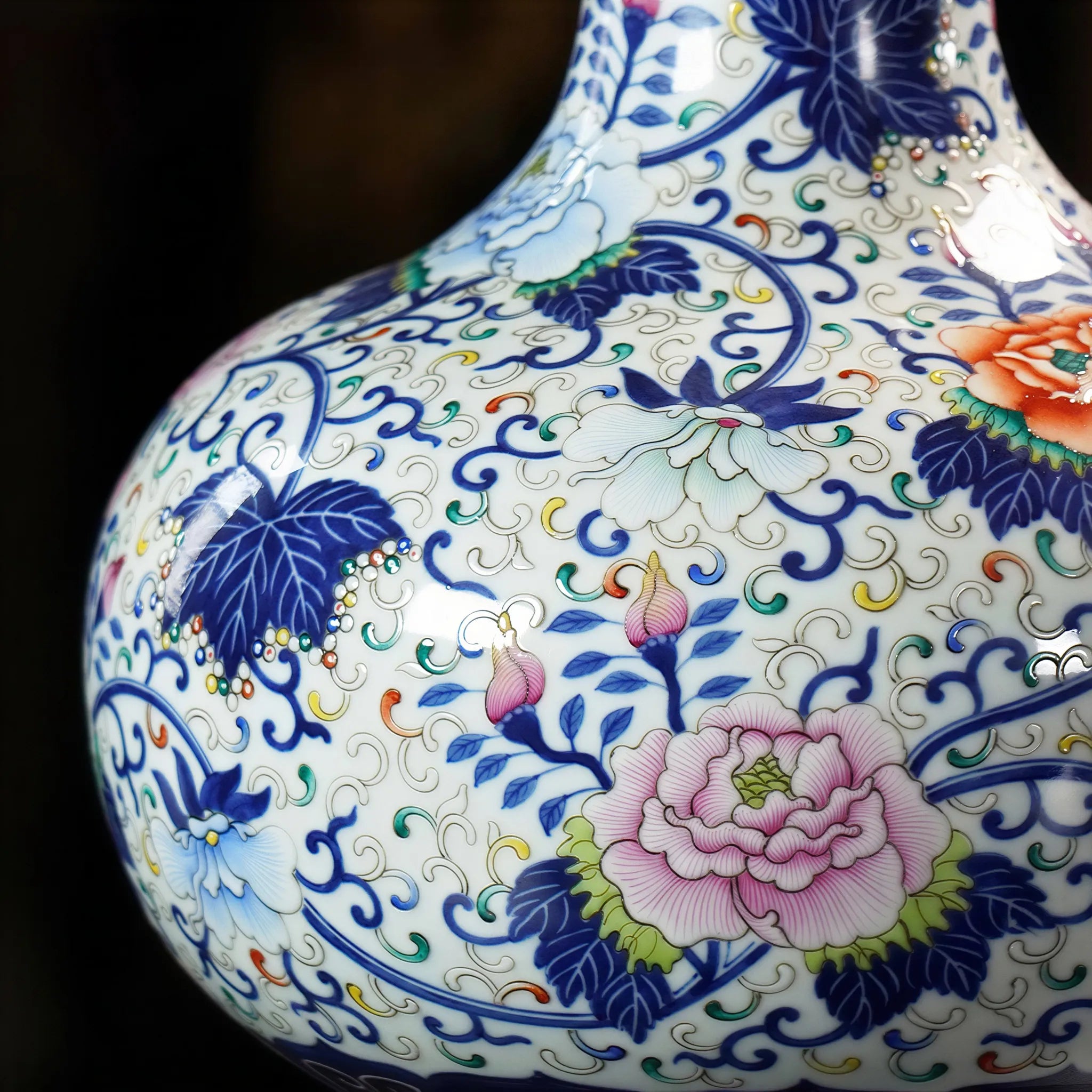 Peony and lotus enamel detail within blue outlines