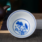 Underglaze blue pine motif inside the doucai teacup
