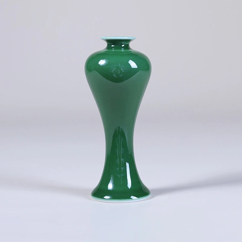 Front view of a tall emerald-green Meiping porcelain vase.